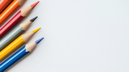 Obraz premium Colorful Pencils on White Paper A Vibrant Study in Art