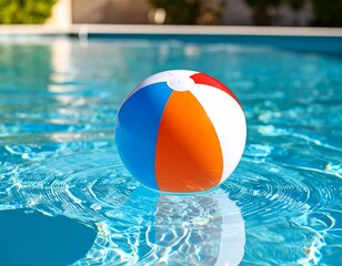 Colorful beach ball in a swimming pool