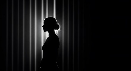 Silhouette of Woman in Dark, Contrasting Light with Abstract Background