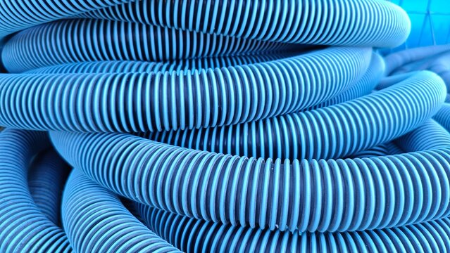 Close up of a large blue water hose with a regular line texture