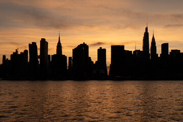 Midtown Manhattan skyline silhouette at dusk