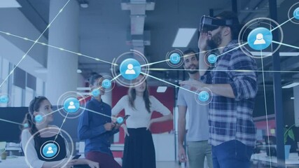 Man placing VR headset while colleagues with devices and navigating user icon network for tech demo - Powered by Adobe
