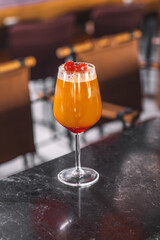 Chilled Orange Beverage in Clear Glass with Fruit Garnish - Fresh Orange-Colored Cocktail with Slice of Orange and Ice.jpg, Chilled Orange Beverage in Clear Glass with Fruit Garnish - Fresh Orange-Col