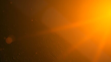 Abstract image of warm, vibrant orange and dark brown tones, with lens flares and subtle patterns