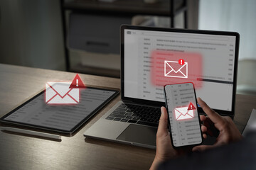 Mail alert, email hack SMS spam image shows person checking email alerts multiple devices, indicating potential security or spam issues
