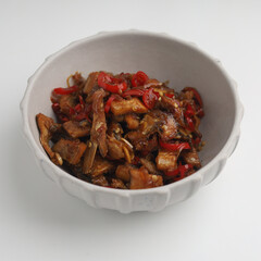 Stir fried salted fish with onion, garlic and chili on the table