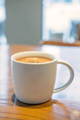 A cup of hot chocolate on the table in the cafe