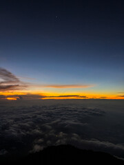sunrise in the mountains above the clouds