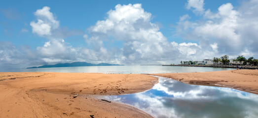Tidal mud flats along the Strand Promenade in CBD Townsville, Queensland, Australia