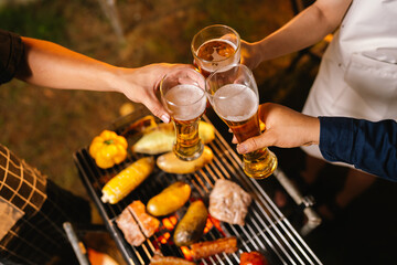 A cheerful summer barbecue gathering with friends and family grilling meat outdoors, enjoying food, laughter, and togetherness in a sunny garden.