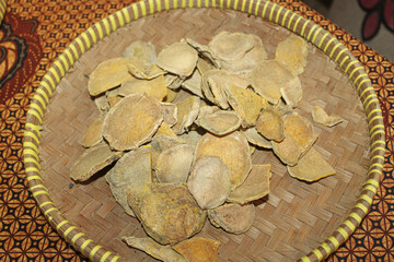 Dried Turmeric Slices in Woven Bamboo Basket