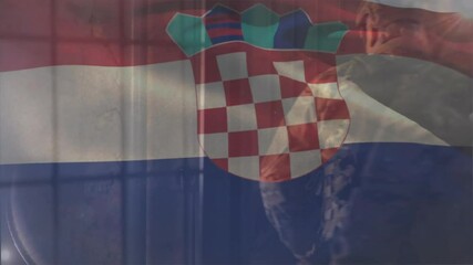 Croatian flag waving revealing two soldiers aiming rifles through window bars guarding defense post - Powered by Adobe