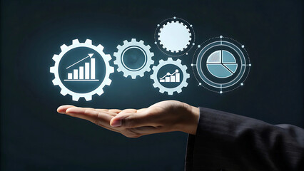 Business hand holding gears with financial growth statistics and pie charts representing business analysis.