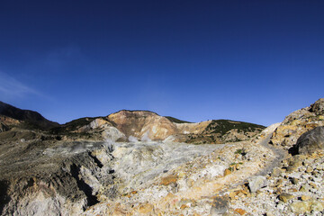 scenery volcano papandayan mountain with summer blue sky at Garut West Java Indonesia 