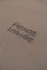Peace Inside – Handwritten Message on Volcanic Sand