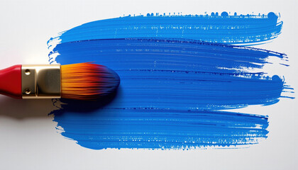 Paintbrush with vibrant blue paint creates smooth stroke on white canvas, showcasing artistic expression and creativity