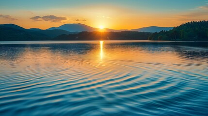 Fototapeta premium A serene lake reflecting the golden hues of a sunset, with gentle ripples and distant mountains