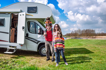 Family vacation, RV travel with kids, happy parents with children have fun on holiday trip in motorhome, camper exterior