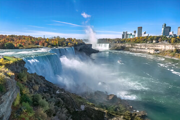 View of Niagara Falls from American side, giant water falls on clear sunny day, Buffalo city, New York, USA