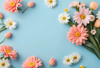 Bouquet of beautiful spring flowers on pastel blue table top view. Greeting card for International Women Day