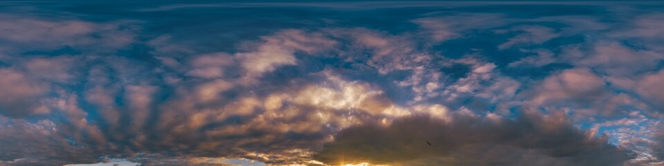 Obraz premium Sunset sky with bright glowing pink Cumulus clouds. Seamless spherical HDR 360 panorama. Full zenith or sky dome in 3D, sky replacement for aerial drone panoramas. Climate and weather change.