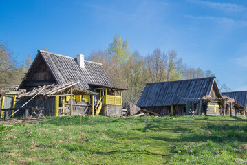 Abandoned old wooden houses. Pskov region, Russia