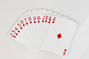 Full set of diamonds playing cards in a sequence on white isolated background