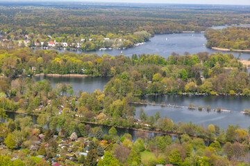 Fototapeta premium aerial of Wannsee in Berlin with villas in green area with trees and boats at the lake