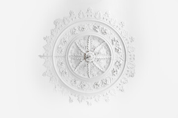 old historic plaster ceiling with round stucco pattern and chop for the candeliere