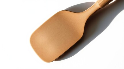 Close-up of a light beige spatula, wooden handle