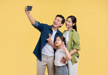 Cheerful family of three takes a selfie together creating a memorable moment in time