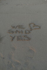 We Said Yes Message on Volcanic Sand with Heart Symbol