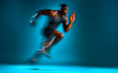 Motion blurred photo of male runner running in action pose with fast pace on bright blue gradient background. Commercial sports photography style.