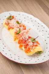 Delicious omelette with smoked salmon and herbs