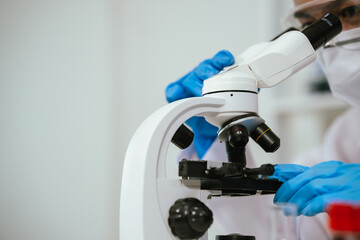 A medical technician analyzes blood samples in a laboratory, using advanced equipment for diagnosis, research, and biotechnology in healthcare science.
