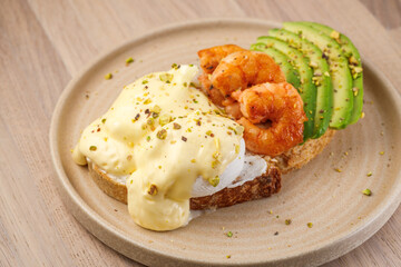 Delicious shrimp and avocado shared on toast