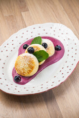 Pancakes with berry sauce on a plate