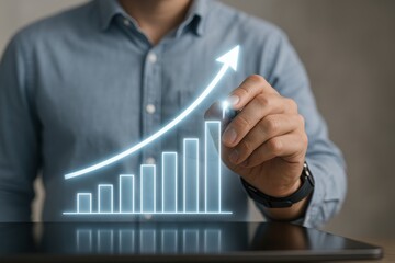 Business Growth Visualization: A modern visualization of business progress with a hand drawing a growing upward arrow over a bar graph symbolizing development, enhancement, and success.