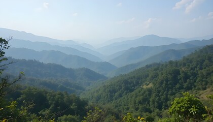 Naklejka premium Layers of majestic green mountains unfold bathed in soft morning haze a tranquil escape into nature s vast embrace with