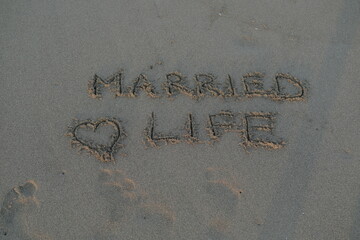 Married Life Message on Volcanic Sand with Heart Symbol