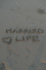 Married Life Message on Volcanic Sand with Heart Symbol