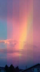 Stunning pastel sunset over a tranquil landscape featuring colorful clouds and a brilliant rainbow effect