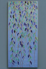 Vibrant cascading leaves create a serene wall art display in soothing blue tones