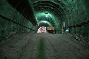 Tunnel Excavation: Excavator Loading Dump Truck