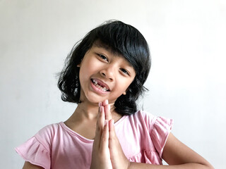 A little girl is eating an ice cream
