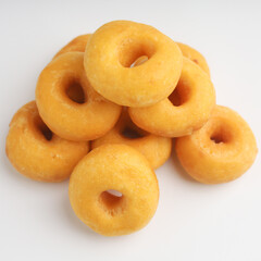 Pile of donuts on white background