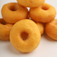 Pile of donuts on white background