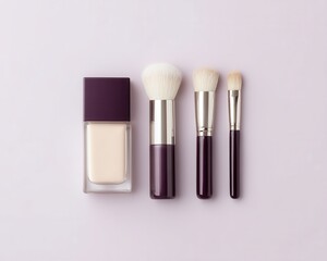 A foundation bottle and three makeup brushes are neatly arranged on a light pastel background.