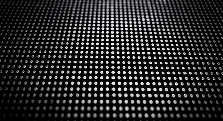 A close up of a black background with many small dots