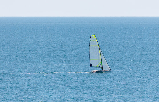 A sailboat is sailing in the ocean